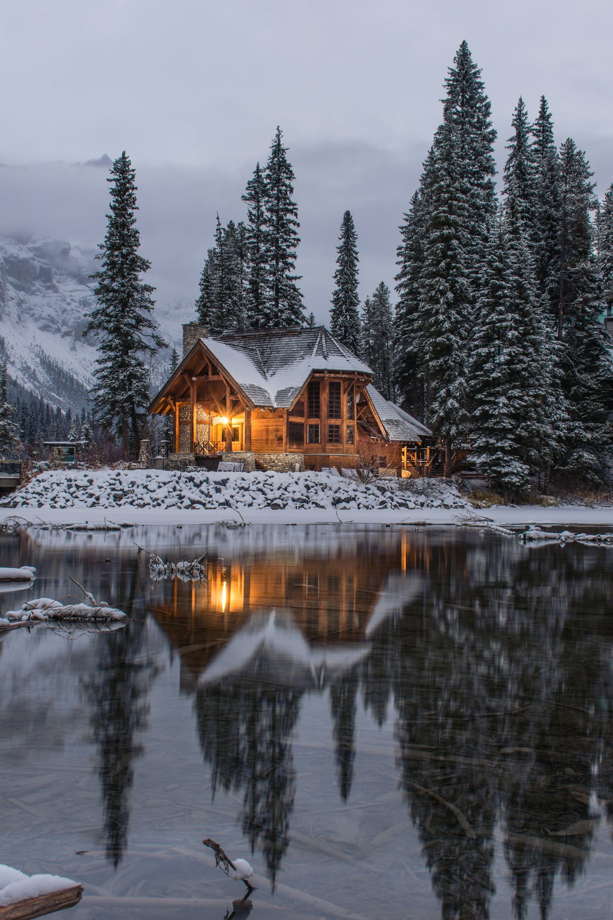 Mountain Cabin: Snowy pines, a crackling fire